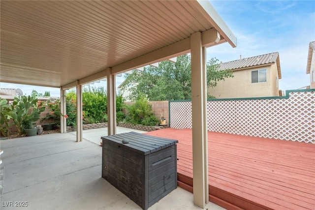 8221 Stoneheather Ct, Las Vegas, NV 89117 - deck featuring a fenced backyard and a patio area