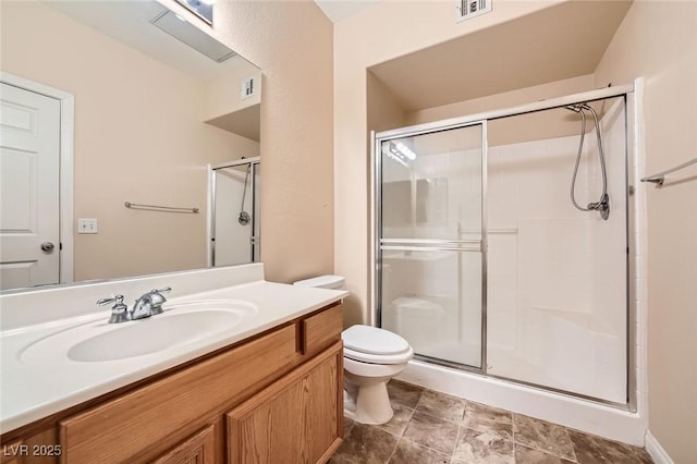 830 Carnegie St Unit 824, Henderson, NV 89052 - bathroom featuring a shower stall, vanity, and toilet