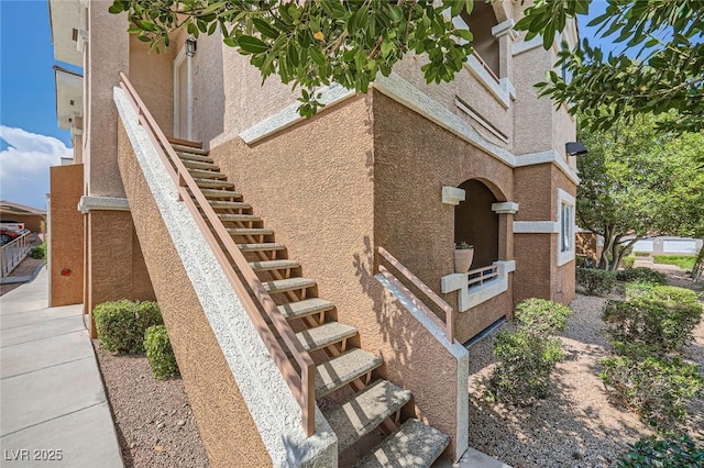 830 Carnegie St Unit 824, Henderson, NV 89052 - view of side of home with stairs and stucco siding