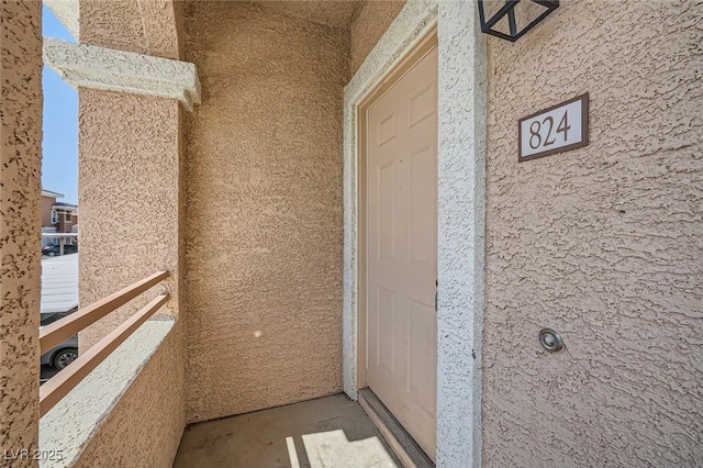 830 Carnegie St Unit 824, Henderson, NV 89052 - property entrance with stucco siding and a balcony