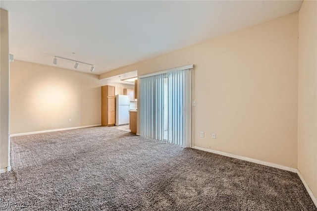 830 Carnegie St Unit 824, Henderson, NV 89052 - empty room with light carpet, baseboards, and rail lighting