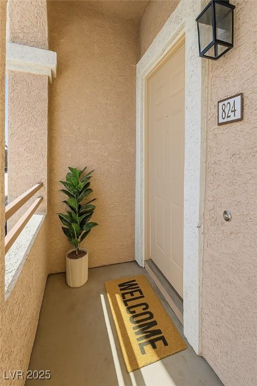 830 Carnegie St Unit 824, Henderson, NV 89052 - entrance to property featuring stucco siding and a balcony