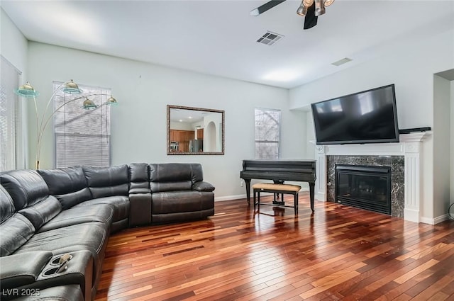 313 Glenridding St, Las Vegas, NV 89183 - living room featuring a ceiling fan, hardwood / wood-style floors, and a high end fireplace