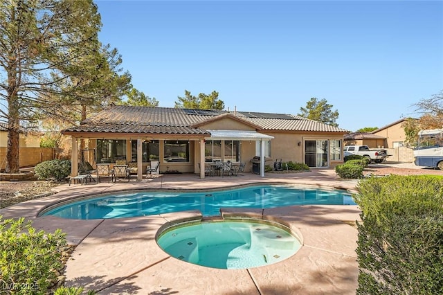313 Glenridding St, Las Vegas, NV 89183 - view of pool featuring a patio area, outdoor dining space, grilling area, and a pool with connected hot tub