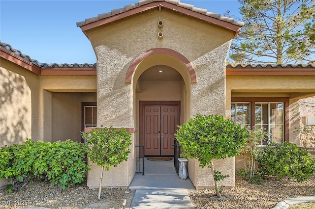 313 Glenridding St, Las Vegas, NV 89183 - entrance to property with a tiled roof and stucco siding