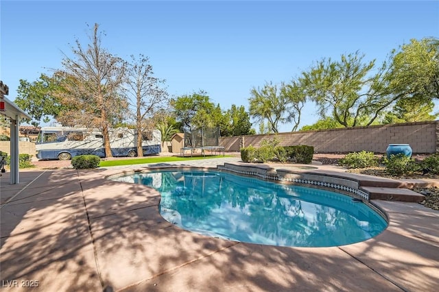 313 Glenridding St, Las Vegas, NV 89183 - view of pool with a trampoline, a fenced backyard, and a patio