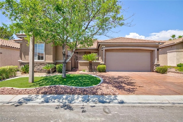 81 Alerion St, Las Vegas, NV 89138 - view of front of property featuring driveway, an attached garage, stucco siding, and stone siding