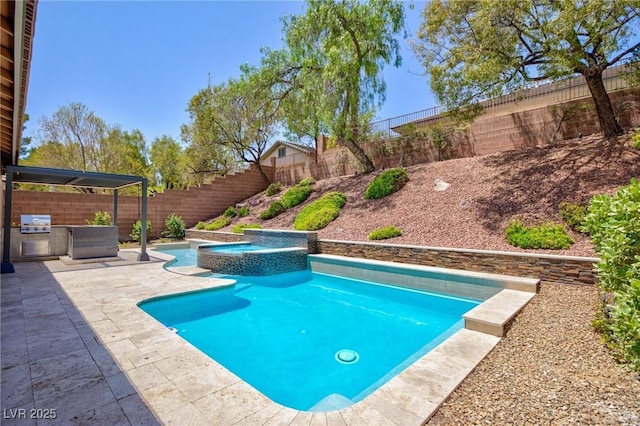 81 Alerion St, Las Vegas, NV 89138 - view of pool featuring a fenced backyard, a patio, area for grilling, and a pool with connected hot tub