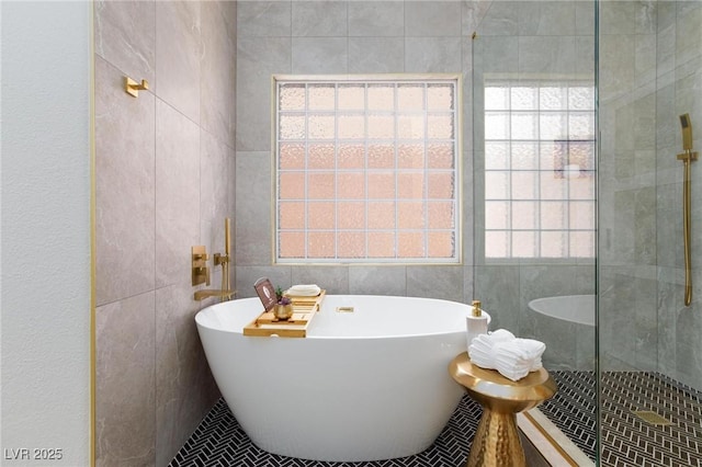 81 Alerion St, Las Vegas, NV 89138 - bathroom with tile walls, a freestanding bath, and a shower stall