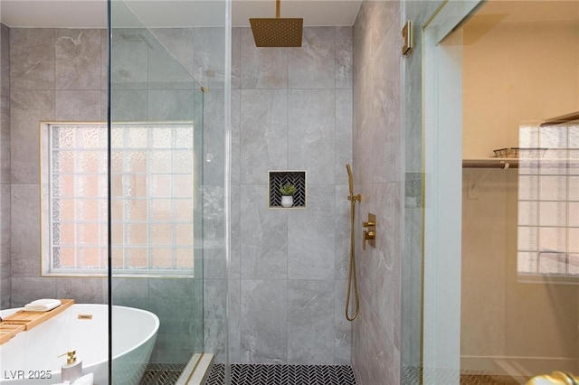 81 Alerion St, Las Vegas, NV 89138 - full bathroom featuring a shower stall, a freestanding tub, and tile walls