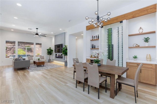 81 Alerion St, Las Vegas, NV 89138 - dining room with light wood finished floors, recessed lighting, a ceiling fan, a chandelier, and baseboards