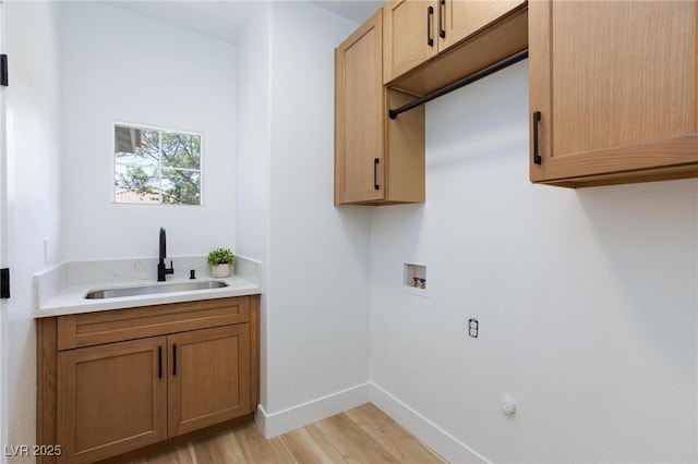 81 Alerion St, Las Vegas, NV 89138 - laundry room featuring hookup for a washing machine, light wood-style flooring, cabinet space, and baseboards