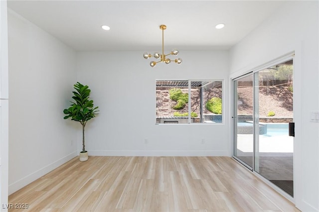 81 Alerion St, Las Vegas, NV 89138 - spare room featuring light wood finished floors, a chandelier, baseboards, and recessed lighting