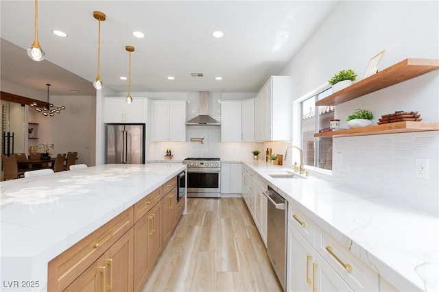 81 Alerion St, Las Vegas, NV 89138 - kitchen featuring high quality appliances, a sink, wall chimney exhaust hood, tasteful backsplash, and recessed lighting