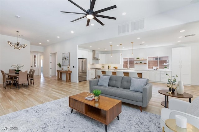 81 Alerion St, Las Vegas, NV 89138 - living area with a ceiling fan, light wood finished floors, a chandelier, and recessed lighting