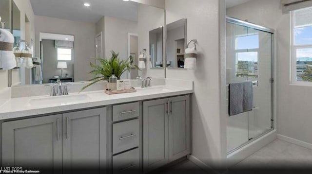 1168 Heliodor Ave Lot 152, Henderson, NV 89011 - bathroom with baseboards, double vanity, a stall shower, and recessed lighting