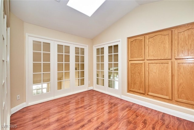 9413 Cedar Heights Ave, Las Vegas, NV 89134 - unfurnished sunroom featuring french doors, lofted ceiling, and a skylight