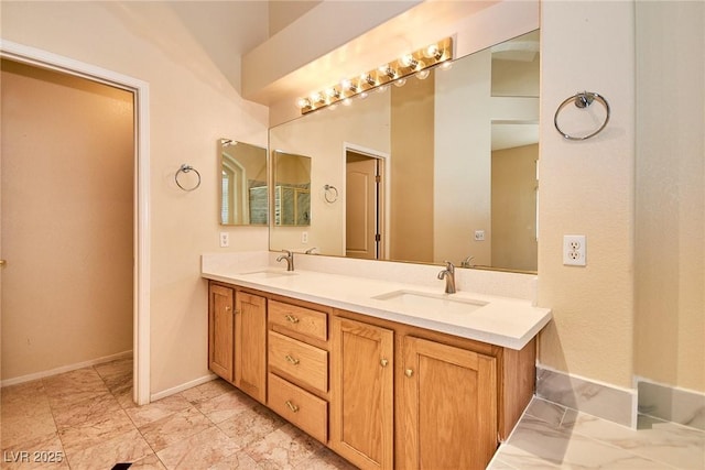 9413 Cedar Heights Ave, Las Vegas, NV 89134 - bathroom with double vanity, baseboards, and marble look tile flooring