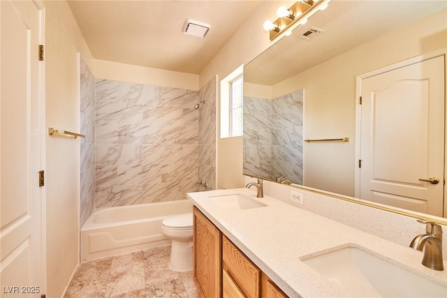 9413 Cedar Heights Ave, Las Vegas, NV 89134 - bathroom featuring tub / shower combination, double vanity, and toilet