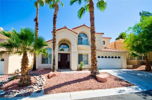 9413 Cedar Heights Ave, Las Vegas, NV 89134 - mediterranean / spanish-style home featuring a balcony, stucco siding, a tiled roof, and driveway