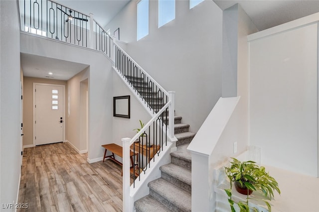 2651 Deep Canyon St, Henderson, NV 89044 - foyer entrance featuring wood finished floors, stairway, and a towering ceiling