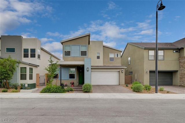 2651 Deep Canyon St, Henderson, NV 89044 - multi unit property with stucco siding, a garage, and decorative driveway