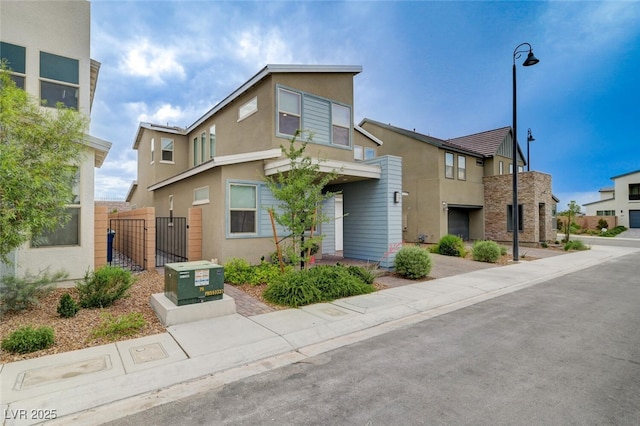 2651 Deep Canyon St, Henderson, NV 89044 - multi unit property featuring stucco siding and a gate