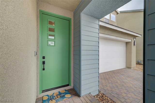 2651 Deep Canyon St, Henderson, NV 89044 - view of exterior entry featuring a garage and stucco siding