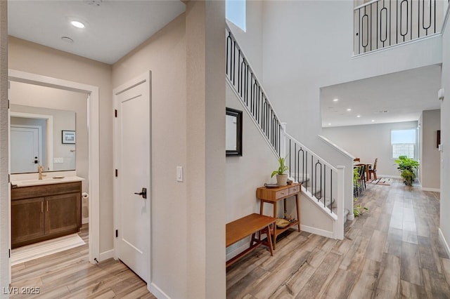 2651 Deep Canyon St, Henderson, NV 89044 - foyer entrance featuring stairway, light wood finished floors, and a towering ceiling