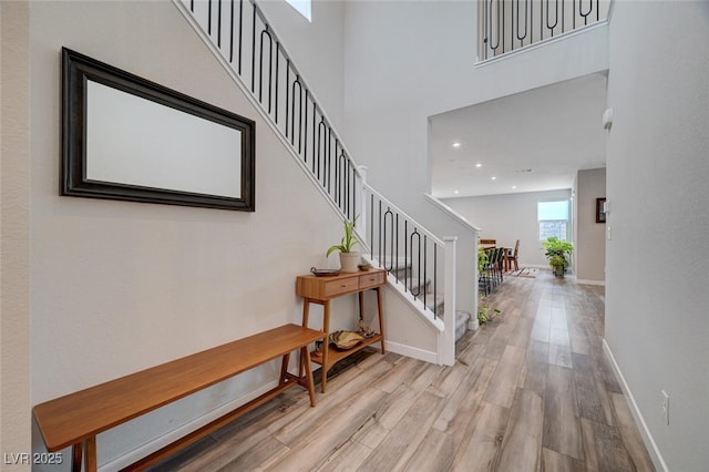 2651 Deep Canyon St, Henderson, NV 89044 - foyer featuring wood finished floors, stairway, a high ceiling, and recessed lighting