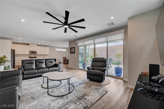 2651 Deep Canyon St, Henderson, NV 89044 - living area featuring light wood-style floors, a ceiling fan, and recessed lighting
