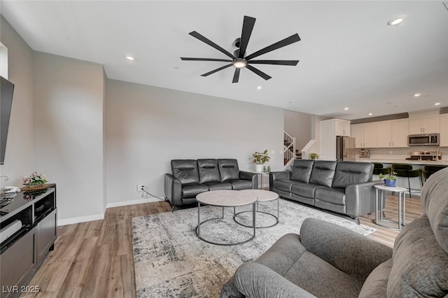 2651 Deep Canyon St, Henderson, NV 89044 - living room featuring stairs, ceiling fan, light wood-type flooring, and recessed lighting