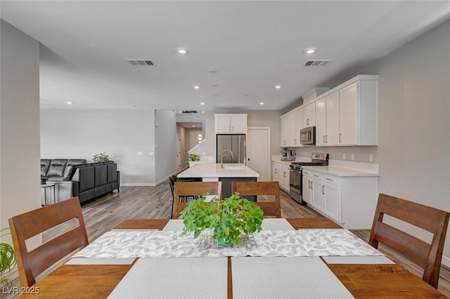 2651 Deep Canyon St, Henderson, NV 89044 - dining space with light wood-type flooring and recessed lighting