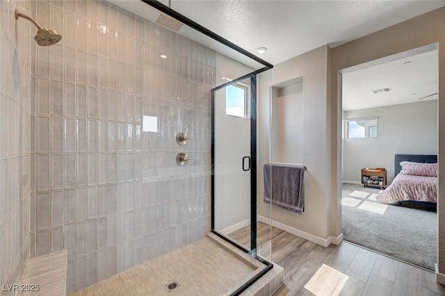 2651 Deep Canyon St, Henderson, NV 89044 - bathroom with wood finished floors, a stall shower, and ensuite bath