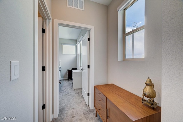 2651 Deep Canyon St, Henderson, NV 89044 - corridor featuring light carpet and baseboards