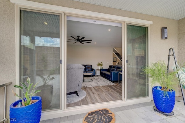 2651 Deep Canyon St, Henderson, NV 89044 - view of exterior entry with stucco siding and a ceiling fan