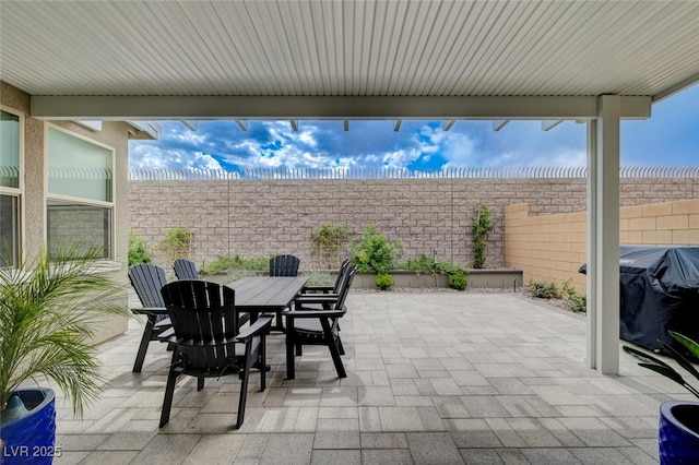 2651 Deep Canyon St, Henderson, NV 89044 - view of patio featuring a grill and outdoor dining area