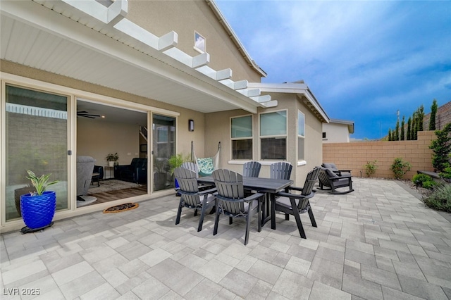 2651 Deep Canyon St, Henderson, NV 89044 - view of patio with outdoor dining space and a fire pit