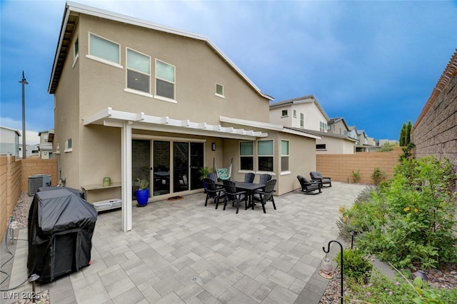 2651 Deep Canyon St, Henderson, NV 89044 - back of house featuring stucco siding, a patio, and a fenced backyard
