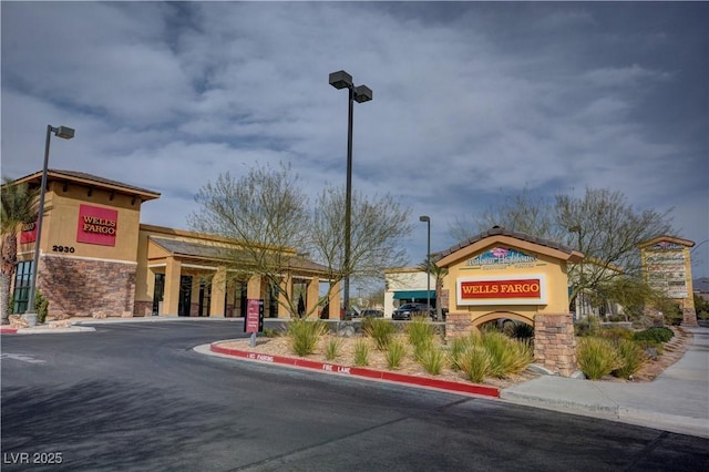 2651 Deep Canyon St, Henderson, NV 89044 - view of asphalt road with street lighting and curbs