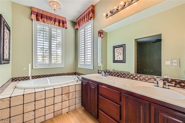 62 Myrtle Springs Ct, Las Vegas, NV 89148 - bathroom featuring a garden tub, double vanity, and wood finished floors