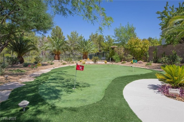 11926 Port Labelle Dr, Las Vegas, NV 89141 - surrounding community with a fenced backyard and an area to practice putting