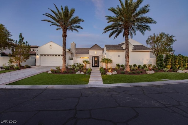 11926 Port Labelle Dr, Las Vegas, NV 89141 - view of front of house with stucco siding, an attached garage, concrete driveway, and a chimney