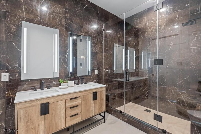 11926 Port Labelle Dr, Las Vegas, NV 89141 - full bathroom featuring double vanity, a marble finish shower, and tile walls