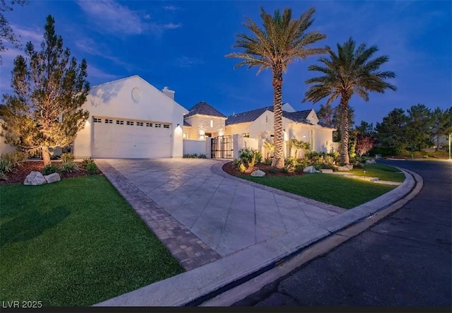 11926 Port Labelle Dr, Las Vegas, NV 89141 - mediterranean / spanish-style home with concrete driveway, a front yard, stucco siding, and a garage