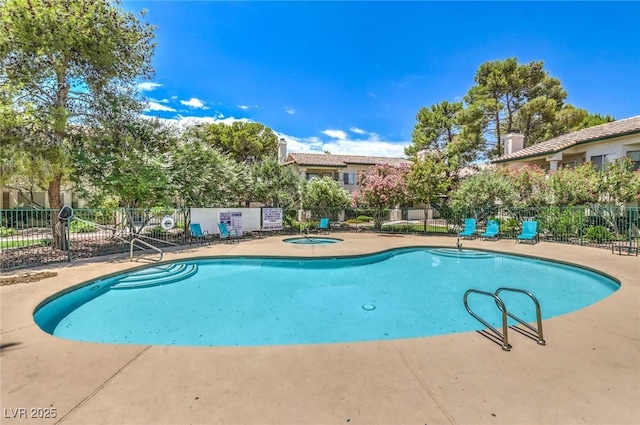 7961 Lions Rock Way Unit 202, Las Vegas, NV 89128 - community pool with a patio and a hot tub