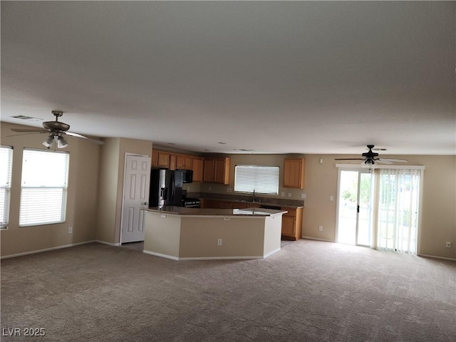 5052 Whistling Acres Ave, Las Vegas, NV 89131 - kitchen featuring a ceiling fan, open floor plan, and black appliances