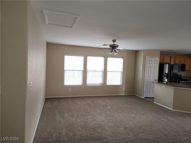 5052 Whistling Acres Ave, Las Vegas, NV 89131 - unfurnished living room with dark colored carpet, ceiling fan, and baseboards
