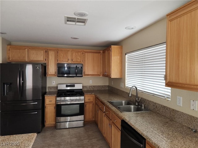 5052 Whistling Acres Ave, Las Vegas, NV 89131 - kitchen with black appliances and a sink