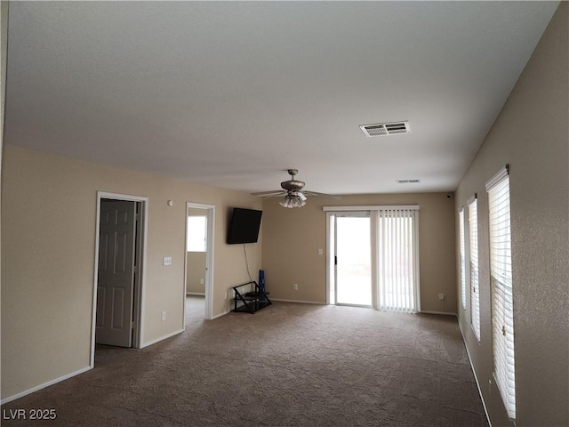 5052 Whistling Acres Ave, Las Vegas, NV 89131 - unfurnished living room featuring carpet, a ceiling fan, and baseboards